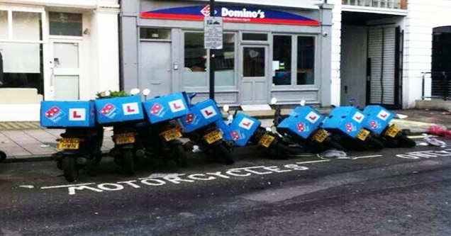 motorcycles fall over like dominos in front of a dominos