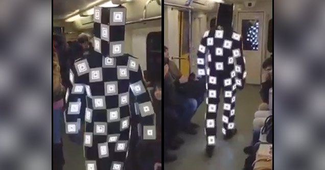 guy with LED flashing suit on subway