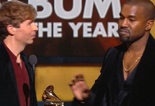 Like he did to Taylor Swift years ago, Kanye stormed the stage to voice his objection after someone other than Beyonce won for Album of the Year (this time Beck won). As a sign of growth however, Kanye thought better of it just before his fingers wrapped around his potential embarrassment-amplifier, and Kanye went back to his seat. Here are people's reactions to the weird event.
