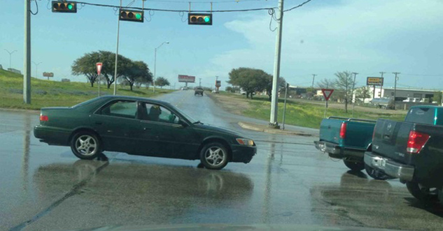 car standing in the middle of the road