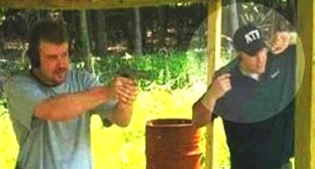 two guys at a gun range one is covering his ear with a pistol