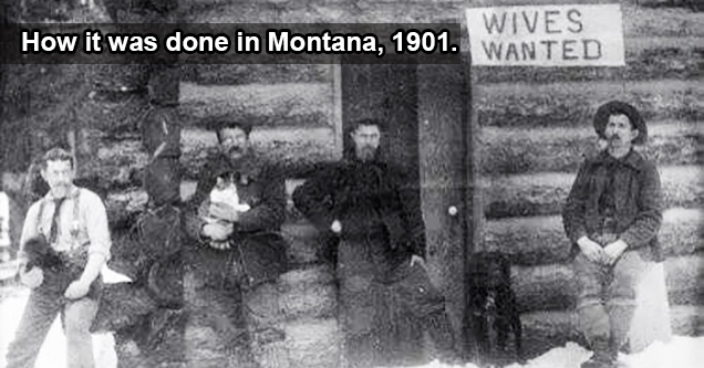 group of men waiting under a wives wanted sign