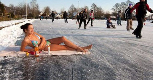 russian girl sun bathing on frozen lake