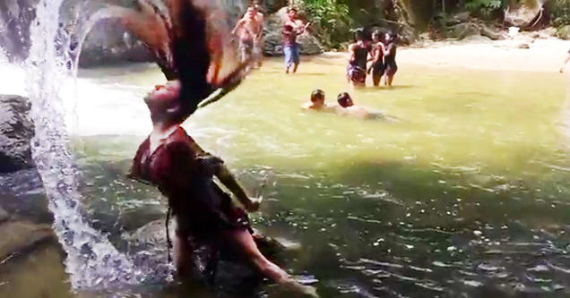 woman flipping her wet hair