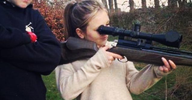 girl shoots gun with eye on scope not using butt stock