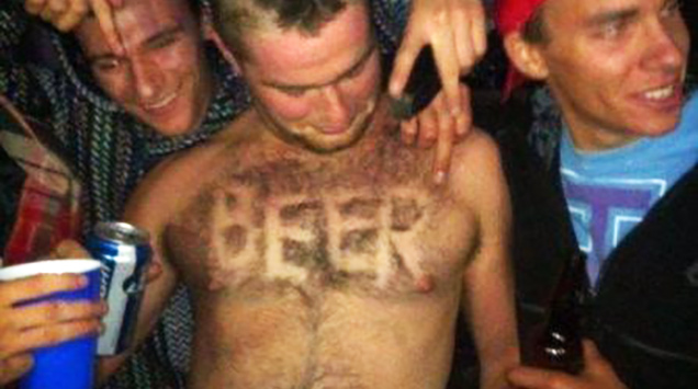 guy has the word beer shaved into his chest