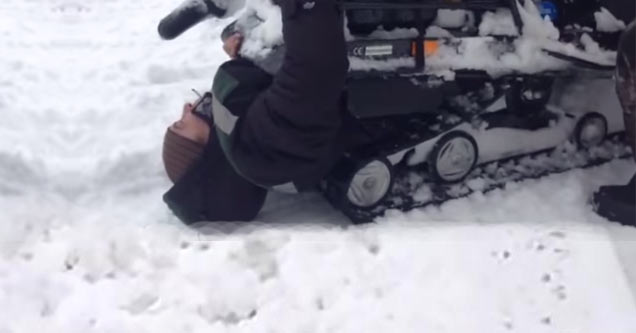 man gets devoured by his snow mobile