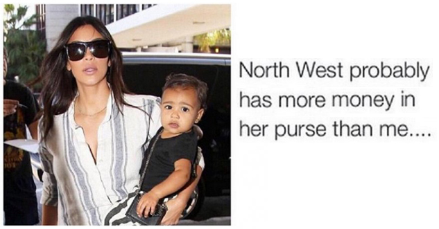 pic of Kim Kardashian holding North West, who is holding a purse.