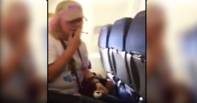 woman smokes cigarette on airplane