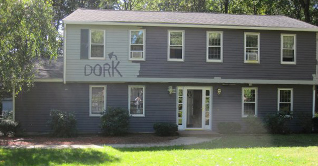 Painted house to say, 'dork' next to an arrow pointing to a window.