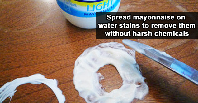 Swipe some mayonnaise on water stains to remove them without harsh chemicals.