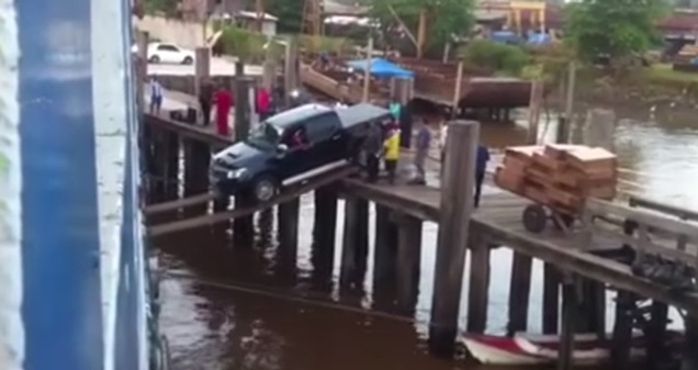 Loading A Truck Onto A Ship With Wooden Planks