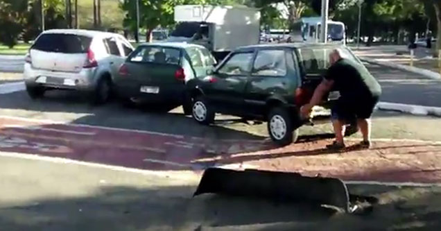 Buff Biker Lifts Car Off of Bike Path