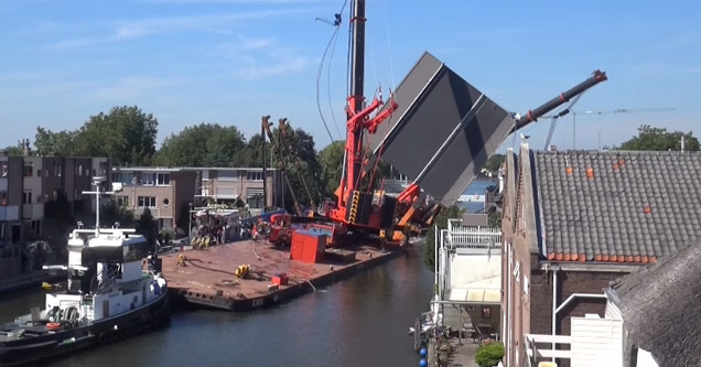 Two Giant Cranes Fall Into Some Houses