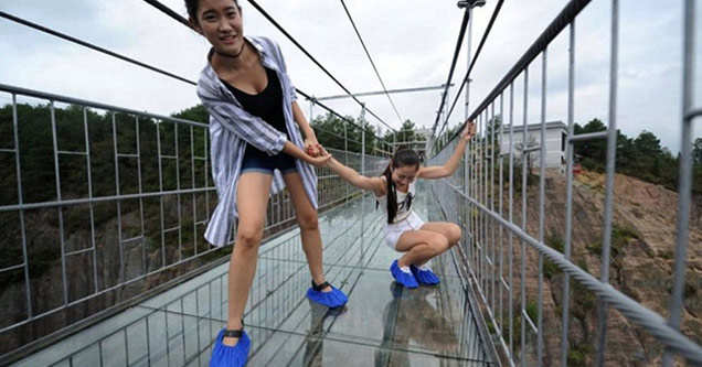 Terrified Tourists Struggle To Cross China's New Glass-Bottom Bridge