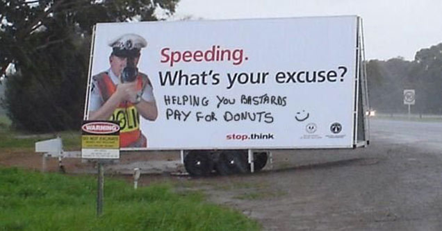 vandalized billboard about speeding in order to finance the police