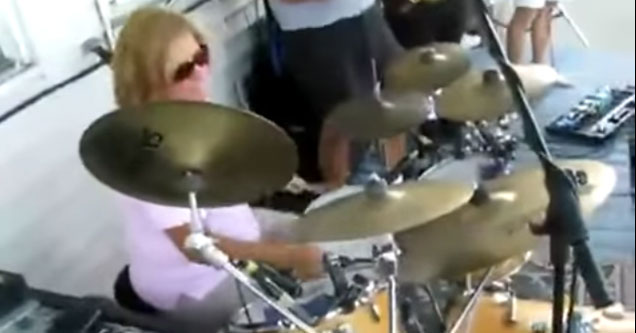 Metal Mom Plays Wipe Out On the Drums