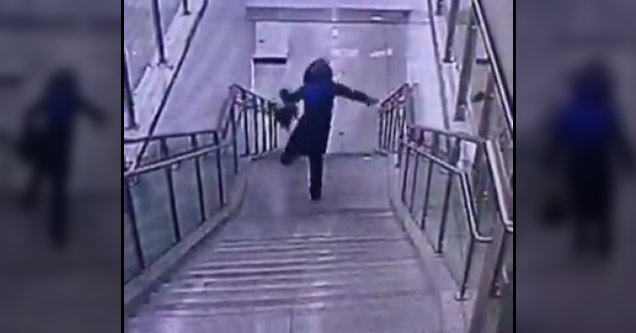 woman falling down stairs