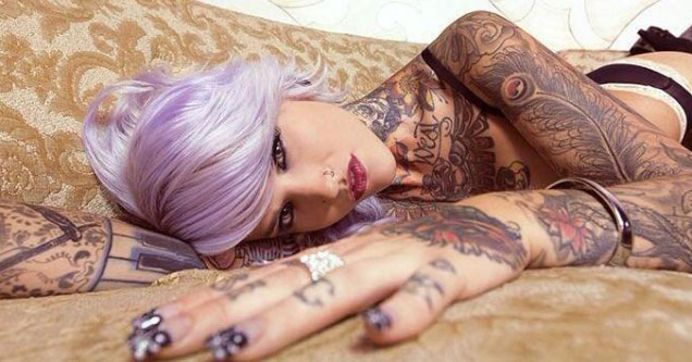 woman with tattoos and purple hair