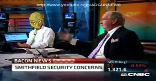 reptilian and man in a news station setting