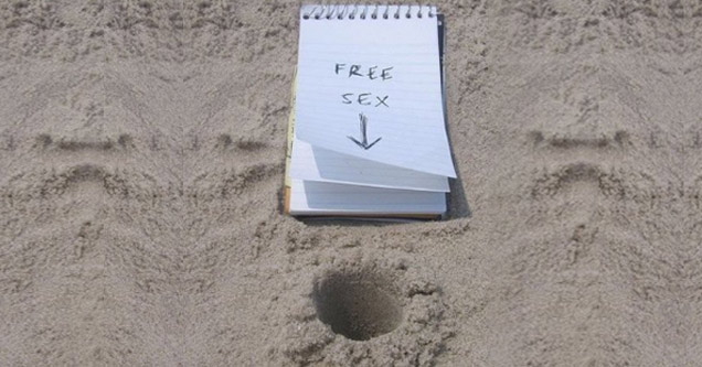 hole in the sand and a note offering free sex