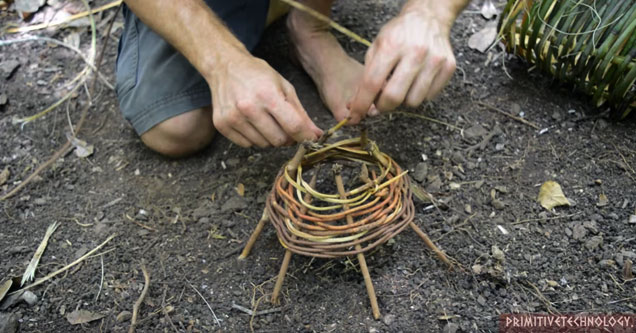 a guy building a shrimp trap