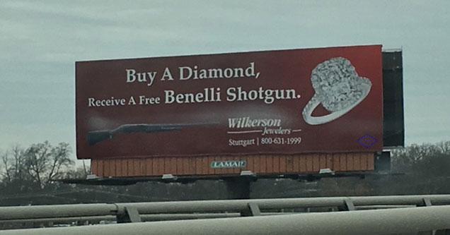 sign advertising rings and guns