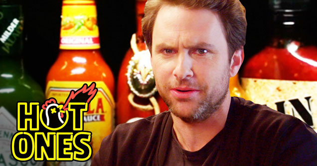 Charlie Day looking at the camera in a screen cap from the series 'Hot Ones'.