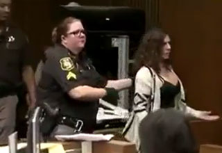 woman thrown in jail after laughing at victims statement