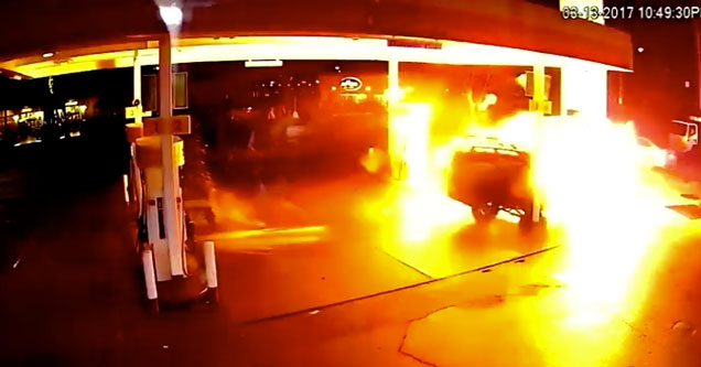 car on fire in a gas station