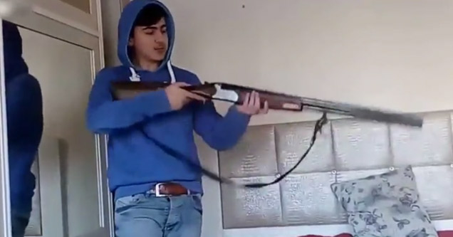 idiot with a shotgun indoors