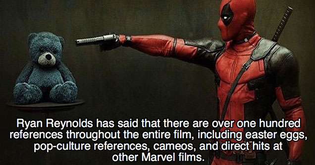 deadpool pointing a gun at a teddy bear