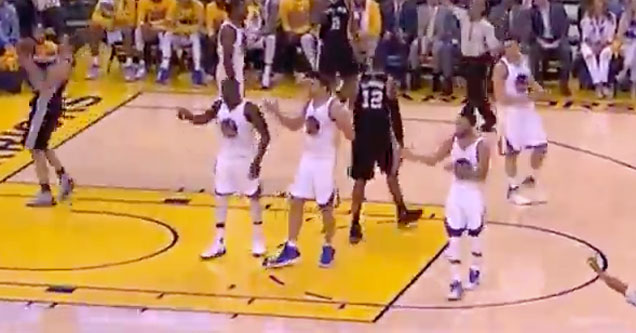 Warriors players Draymond Green, Zaza Pachulia and Steph Curry all make the same arm movement at the same time