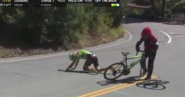 cyclist laying on road after crashing