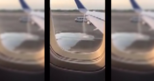 cellphone video out airplane window of plane leaking fuel