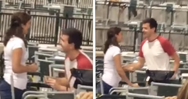 man proposing to his girlfriend at baseball game