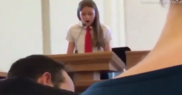 young girl in white shirt and red tie