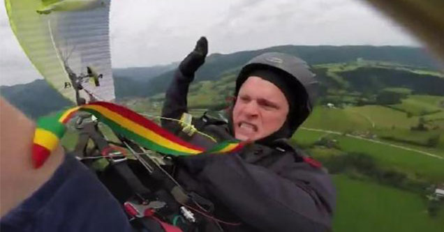 paraglider falling to earth making a very intense face