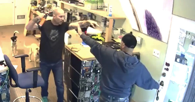 shop owner pointing mace at a customer who wont pay his bill