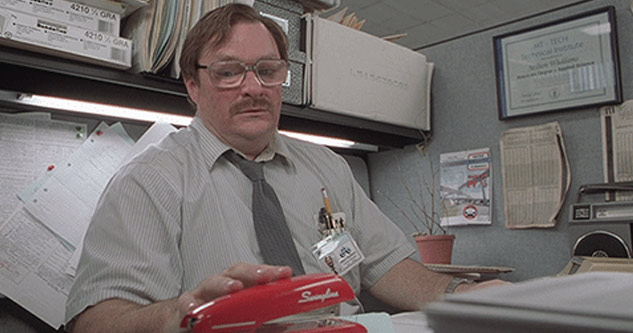 scene with milton from office space  looking at red stapler