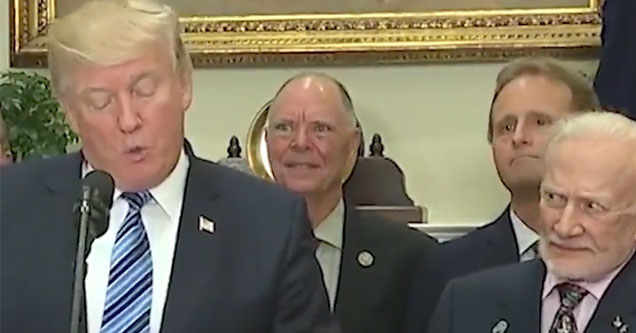 buzz aldrin giving trump funny looks