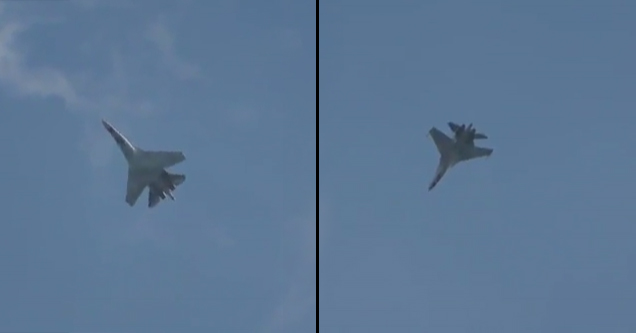 fighter jet flies upside down and floats in the sky