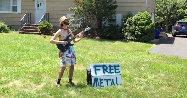 guy playing guitar in his front yard with a sign that says free metal