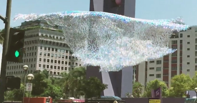 Giant Floating Silver wave hangs above LA square