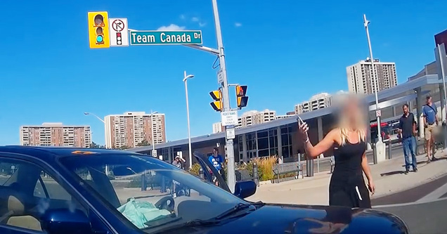 girl in street next to car crash