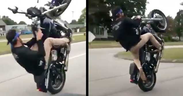 guy popping a crazy wheelie on a motorcycle