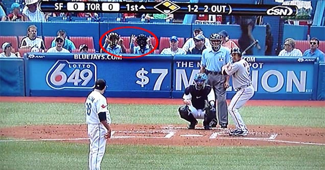 Baseball fan umpires in the dugout