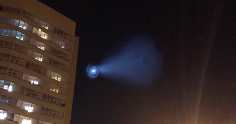 ufo behind a building