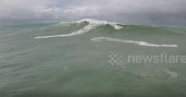 big wave surfer has his life saved by jetski driver