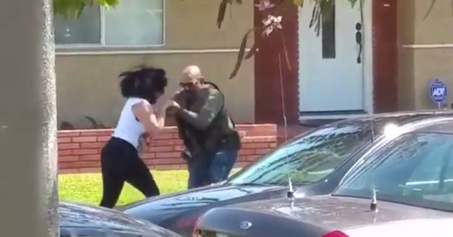 woman wrestling with cop over phone